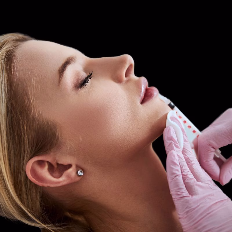 Professional performing dermal filler dissolver treatment in Huntington, NY.